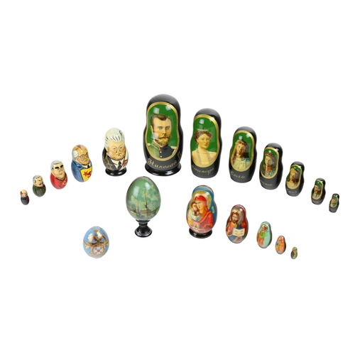 335 - A large painted wooden Russian Doll, each graduating, decorated with members of the Tsars, also a sm... 