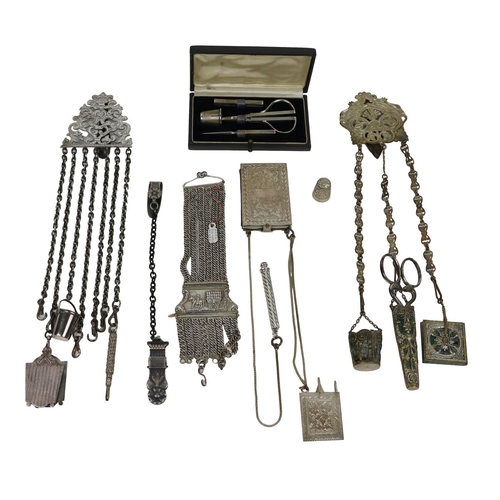 338 - Three varied Victorian and Edwardian Chatelaines, with various accoutrements; together with a cased ... 