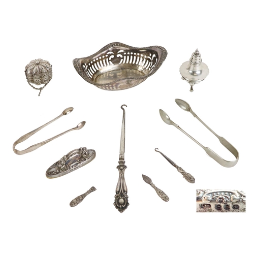 141 - Silverware: An unusual stepped silver Pepper Shaker (Chester); a silver pierced decorated Baske... 