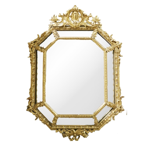 456 - An attractive 19th Century Continental giltwood cushion Mirror, the cornice with central cartouche a... 