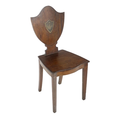 473 - A Georgian mahogany shield back Hall Chair, with central painted crest panel for the Westropp Family... 