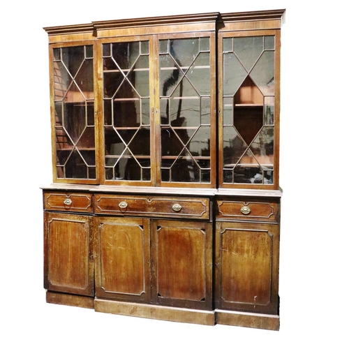 480 - A Georgian period mahogany breakfront Bookcase, the moulded cornice over four astragal glazed doors,... 