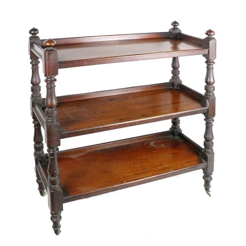 516 - An Irish 19th Century mahogany framed three tier Dumbwaiter, with turned finials and pillar supports... 