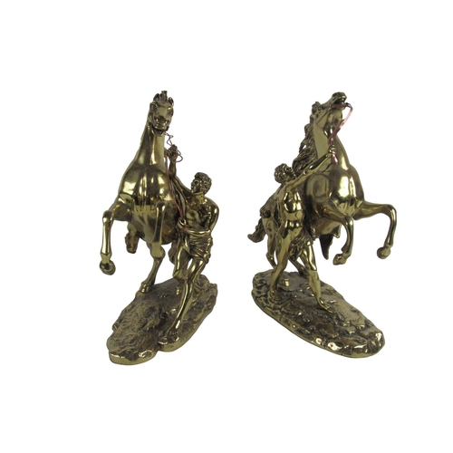 521 - After Guillaume Cousteau (1677-1746)A pair of bronzed metal Marley Horses and attendants, each appro... 