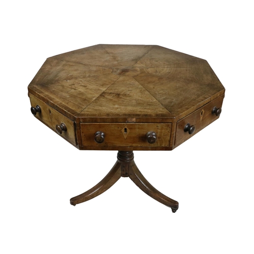 531 - A 19th Century mahogany octagonal Centre or Rent Table, the segmented top with wide crossbanding ove... 