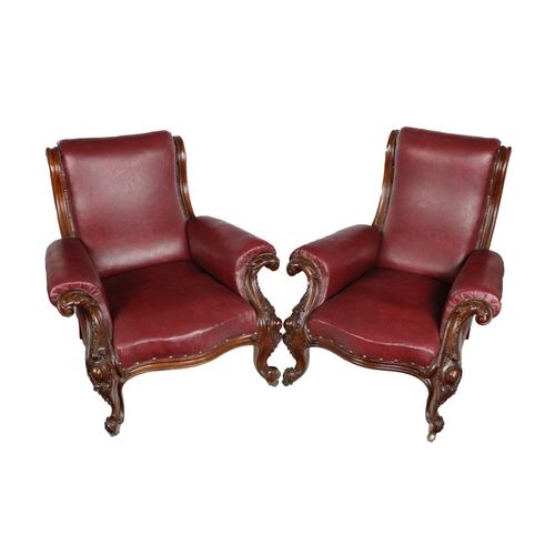 532 - A large pair of Irish Victorian mahogany framed Library Armchairs, in the manner of Strahan, each wi... 