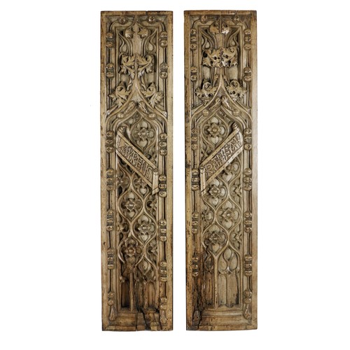 302 - A pair of Gothic style carved oak upright Panels, decorated in the typical taste, each approx. 68cms... 