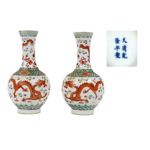 272 - A pair of 19th Century Chinese tubular porcelain Dragon Vases, with opposing dragons on top and main... 