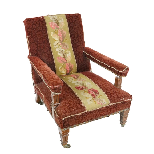 548 - An Edwardian oak framed Easy Armchair, by Gillows of Lancaster, stamped, covered in red brocade fabr... 