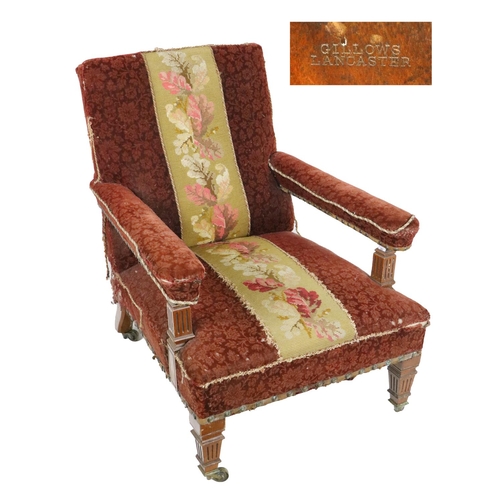 548 - An Edwardian oak framed Easy Armchair, by Gillows of Lancaster, stamped, covered in red brocade fabr... 