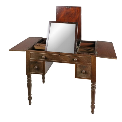 549 - A 19th Century mahogany Gentleman's Dressing Table, with central lift top and side openings wit... 