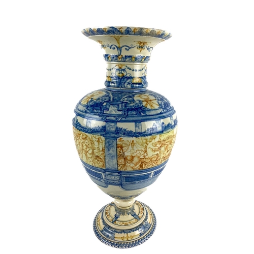 552 - A Majolica Urn, of circular baluster form with flared rim, the body decorated with Renaissance style... 