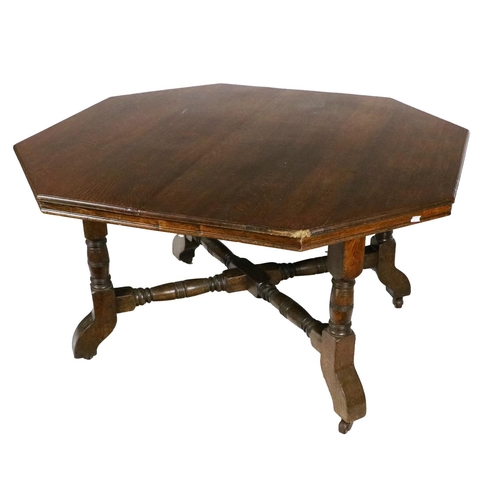 556 - A Victorian oak octagonal Centre or Library Table, in the manner of Augustus Pugin, the shaped top w... 