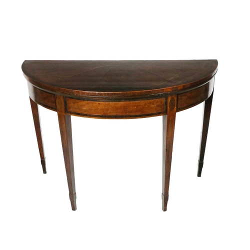 572 - A 19th Century fold-over demi-lune mahogany Card Table, the segmented top with wide crossbanded bord... 