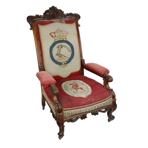 625 - A fine quality Irish Victorian rosewood armorial Armchair, the cornice with carved decoration above ... 