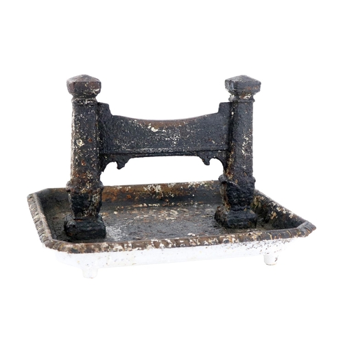 637 - A Victorian Coalbrookdale cast iron Footscraper, modelled as London Bridge, above a tray with beaded... 