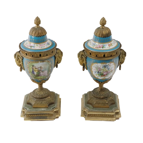 653 - A pair of attractive Louis XVI ormolu mounted and hand painted porcelain Vases, each with domed remo... 