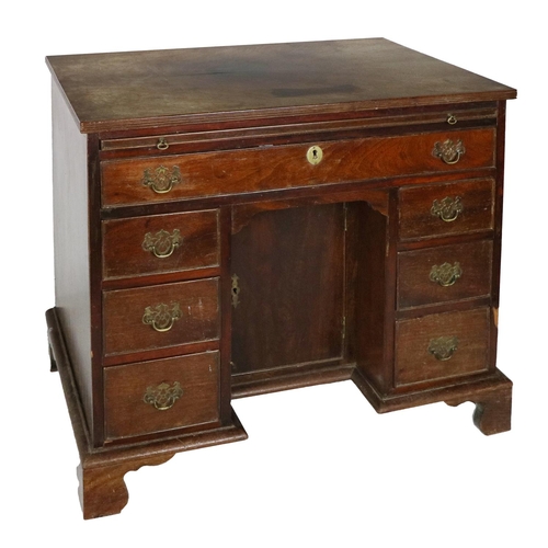 663 - A Georgian mahogany Bachelors Chest, the plain top with reeded edge with brush and slide with long d... 