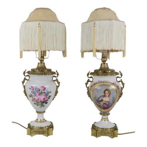 700 - A pair of attractive Continental 19th Century porcelain and ormolu Lamps, each with frilled Damask S... 