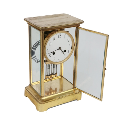 716 - A 19th Century French brass cased Mantle Clock, with glazed frame, circular enamel dial with Arabic ... 