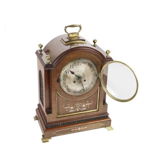 718 - An attractive Irish mahogany cased Mantel Clock, Edwardian, with domed top with brass finials and ca... 