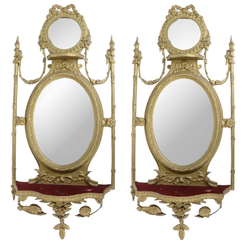 725 - An attractive pair of 19th Century giltwood Mirrors, in the Adams taste, the cornice with love knot ... 