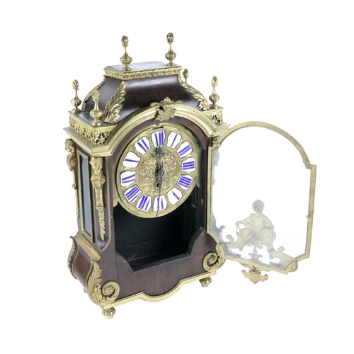 756 - A French Boulle Mantel Clock, with overall ornate mounts and finials with enamel Roman numeral dial ... 