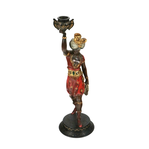 758 - A Victorian coloured painted Model, of Arab Man holding vase aloft, wearing head dress in bright red... 