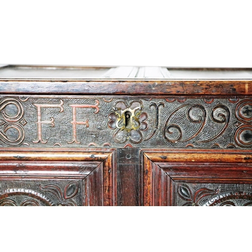 771 - A late 17th Century lift top oak Coffer, with original hinges opening to reveal compartment and door... 