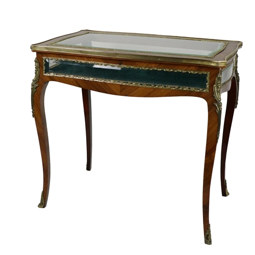 773 - A Louis XV style kingwood lift top Table Curio Cabinet, with glazed top with ornate ormolu rim, bras... 