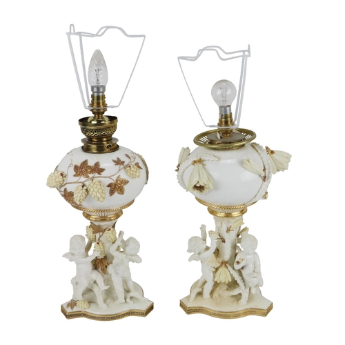 777 - Two similar porcelain creamware and gilt highlighted Oil Lamps,(converted) by Moore Bros., each well... 