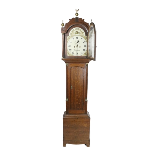 783 - A 19th Century oak cased Grandfather Clock, the hood with ornate brass finials housing a painted arc... 