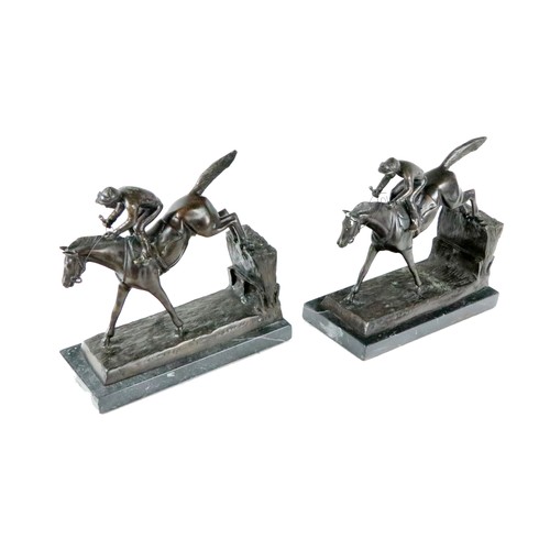 732 - A pair of heavy bronze Book Ends, modelled as horse and jockey jumping a fence each mounted on black... 