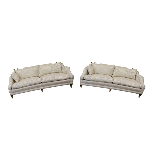 812 - A pair of monumental two seater Couches, by Duresta, each covered in cream and champagne damask fabr... 