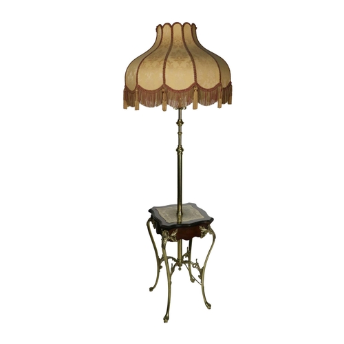 824 - A late Victorian telescopic brass Lamp, (converted) on table base with moulded top and ornate cabrio... 