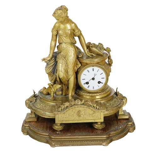 834 - An attractive 19th Century French gilt Mantle Clock, depicting a young lady in low cut dress leaning... 