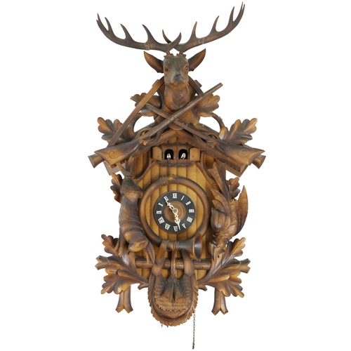 839 - A German style Blackforest carved wooden Wall Clock, with deer, guns and dead game, with circular di... 