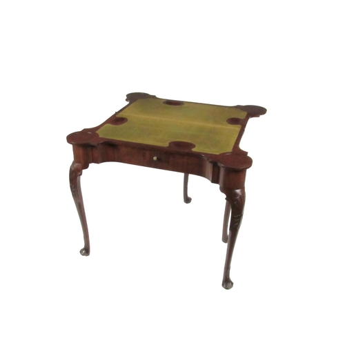 847 - A fine quality Irish Georgian period mahogany fold-over Card Table, the shaped top opening to reveal... 