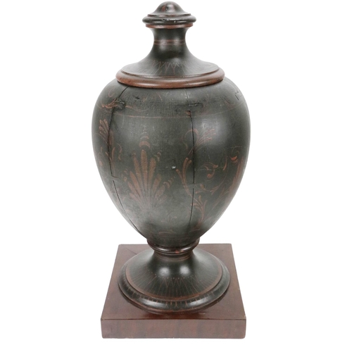 863 - An 18th Century urn shaped Grecian design Tea Caddy, with lift top on a circular base mounted on a l... 