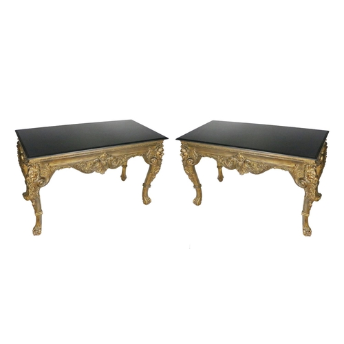 867 - An attractive pair of George III style giltwood Tables, each with heavy black marble top above a fri... 