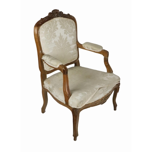 905 - A 19th Century French carved fruitwood Fauteuil, the shield back with carved top issuing scroll... 