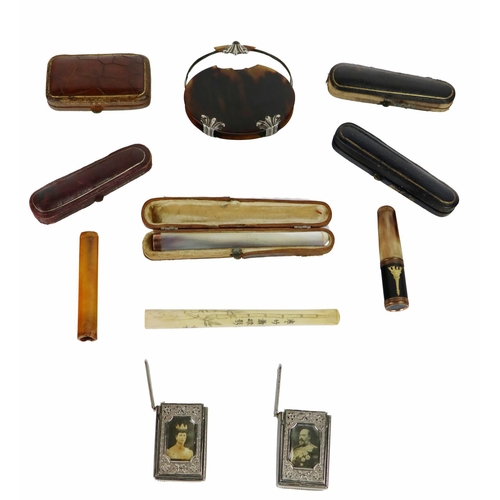 907 - A collection of cased Cigarette Holders, (some with gold mounts), also two plated Vesta Cases with r... 