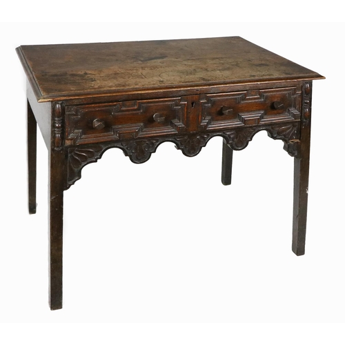 927 - An early 19th Century French Provincial oak Side Table, moulded above carved geometric and carved fr... 