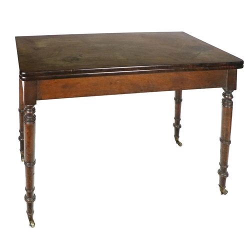 930 - A George IV mahogany fold-over top Tea Table, with rounded corners on ring turned legs, approx. 96cm... 