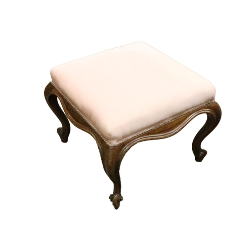 934 - A Victorian walnut Footstool, with pink fabric padded seat on cabriole legs. (1)