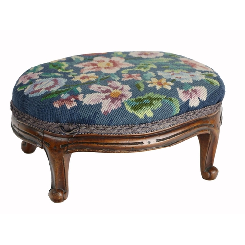 947 - An Edwardian oval shaped walnut framed Footstool, with floral needlework cover on cabriole legs. (1)... 