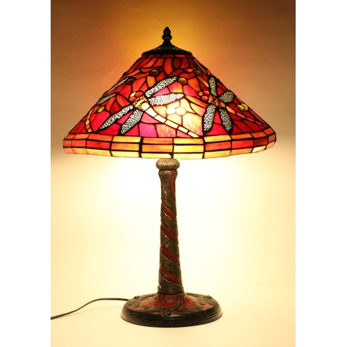 1014 - A Tiffany style Dragonfly Table Lamp, the glass shade of red colour with flying insect design, on a ... 