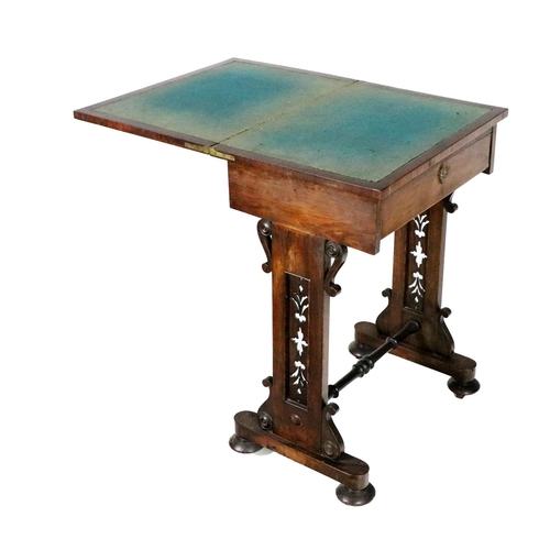 976 - A Victorian Irish rosewood fold-over Card Table, with frieze drawer pierced decorated supports unite... 