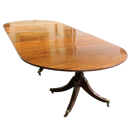 978 - A Georgian period three pod Dining Table, with figured top and reeded edge over three quadruple pods... 