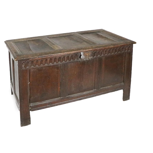 981 - An 18th Century oak lift top Blanket Chest, the top with three panels and original hinges above a fr... 